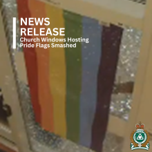 Picture of Pride flag in window with Shattered Glass