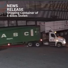 Tractor used to steal green shipping container of E-Bikes